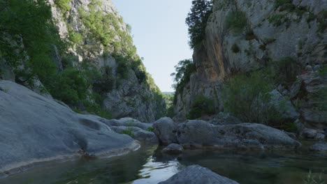4K-Cinematic-nature-travelling-footage-of-the-waterfall-Gubavica-inside-the-mountain-canyon-next-to-Split,-Croatia-on-a-sunny-day