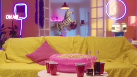 young woman watching movie at home with popcorn