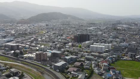 aerial view of matsumoto city with dolly forward, tilt up shot