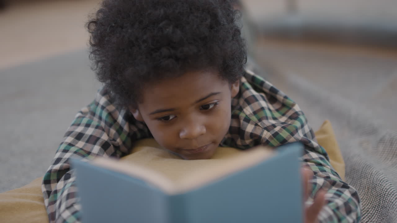 Cute Afro Kid Reading Book