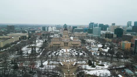 slow decent wide aerial downtown legislative historic building winnipeg manitoba canada during a foggy afternoon