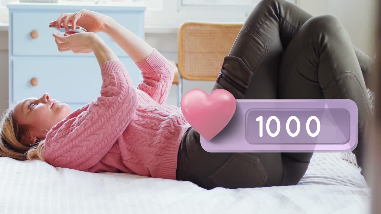 ⁇ 드폰 4k를 타이핑하는 동안 침대에 누워있는 여자