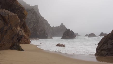 stormy waves at praia da ursa in portugal