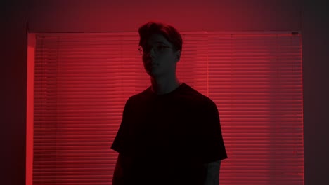 red lit portrait of young man