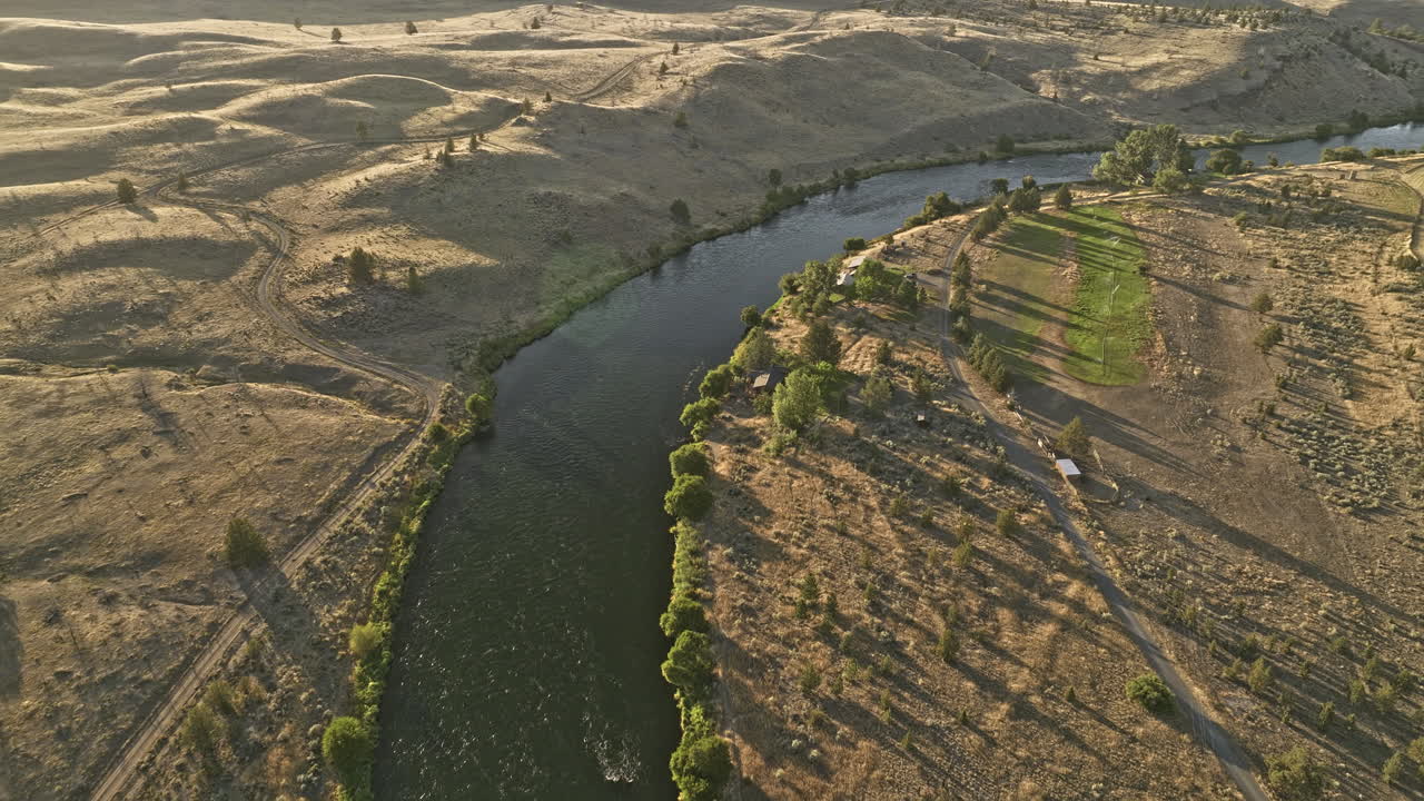 Deschutes River Oregon Aerial v76 birds eye view flyover Skookum Creek capturing riverside ranch homes and railroad tracks running along the river at sunset - Shot with Mavic 3 Cine - August 2022
