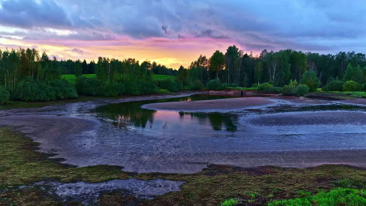 Peaceful sunset over forest lake, serene atmosphere with vibrant colors