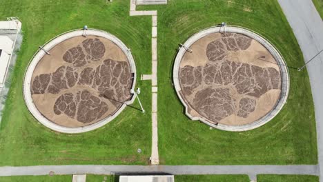 aerial top down of sewage treatment plant with sludge. process of removing contaminants of from wastewater. sunny day in america