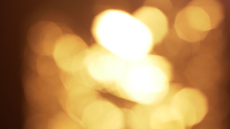 Abstracte Gouden Bokeh Lichten Glinsterend op Donkere Achtergrond