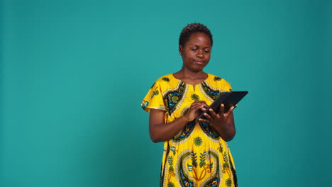 Young-woman-checking-her-social-media-platforms-in-studio