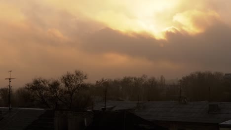 red, fiery, orange sky at dawn, covered with smoke from a fire, hiding sun. 4k