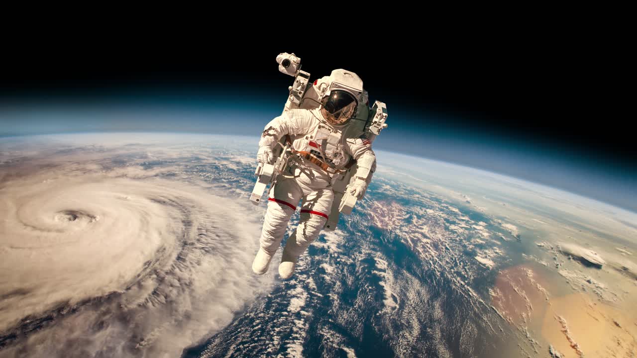 Astronaut in outer space against the backdrop of the planet earth. Typhoon over planet Earth. Elements of this image furnished by NASA.
