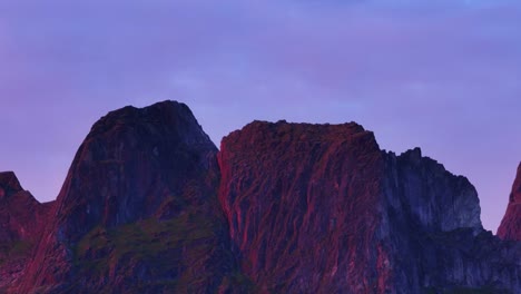 craggy sheer mountains near husøy village in senja, troms og finnmark county, norway