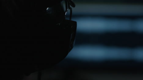 silhouette of someone wearing a football helmet