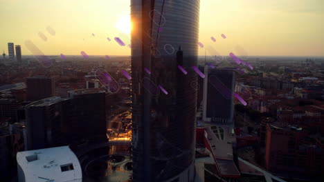 animation of purple light flares moving over city at sunset