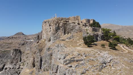 rising drone shot of the acropolis of lindos on the island of rhodes