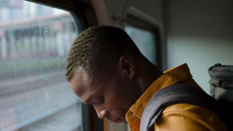 man traveling by train