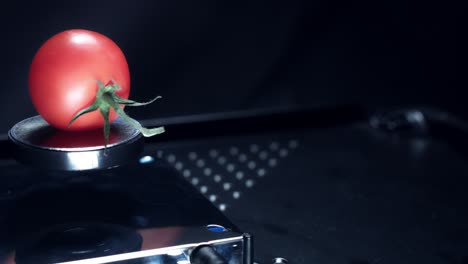 4k abstract levitation platform with tomato on black background