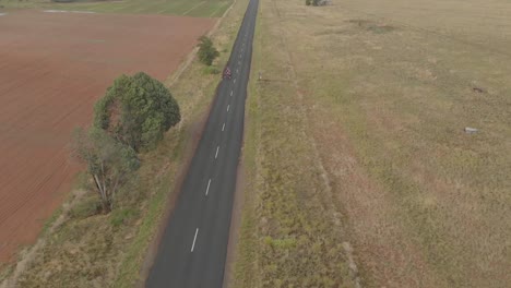 AERIAL-Overcast-Day-Following-Peloton-of-Cyclists