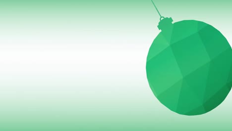 animation of green christmas bauble over green background