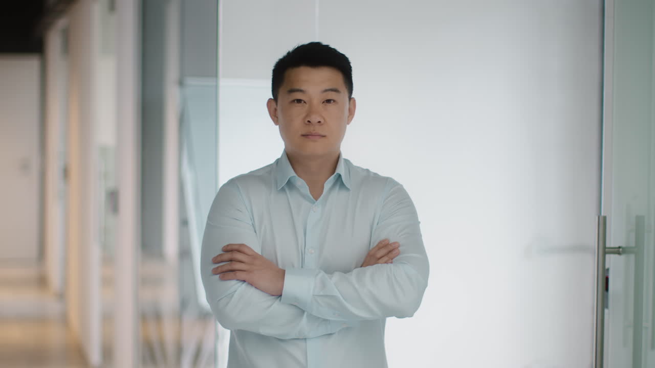 Confident Asian Business Man in Office