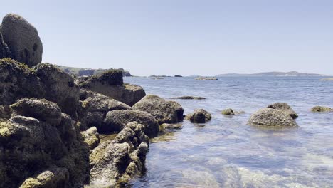 static shot of seascape with rocks and clear water in sunny day