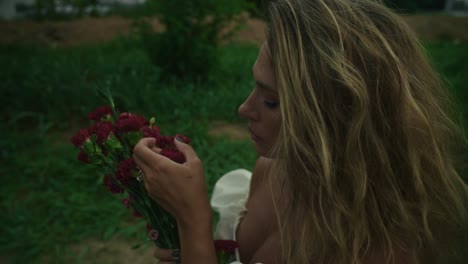 woman with carnations in a garden