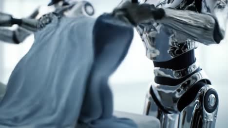 robotic hands in action: a showcase of advanced automation and precision in folding textiles and enhancing workplace efficiency with innovative technology