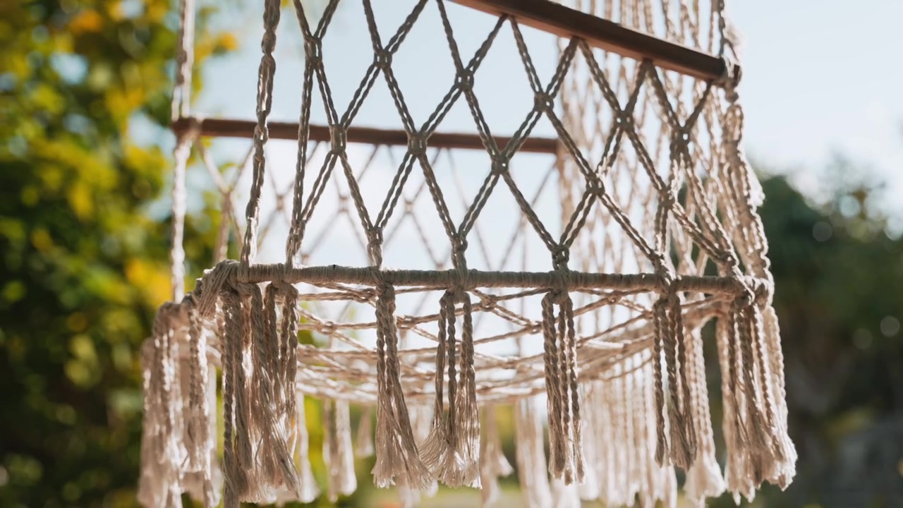 Macramé schommelstoel, exotisch, mediterraan, tropisch, vrijetijdsdecoratie, decoratieve meubels, close-up