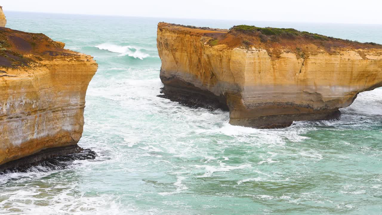 Stunning coastal cliffs and turquoise waves under soft daylight at Port Campbell, VIC, Australia. Captured in a serene, natural setting