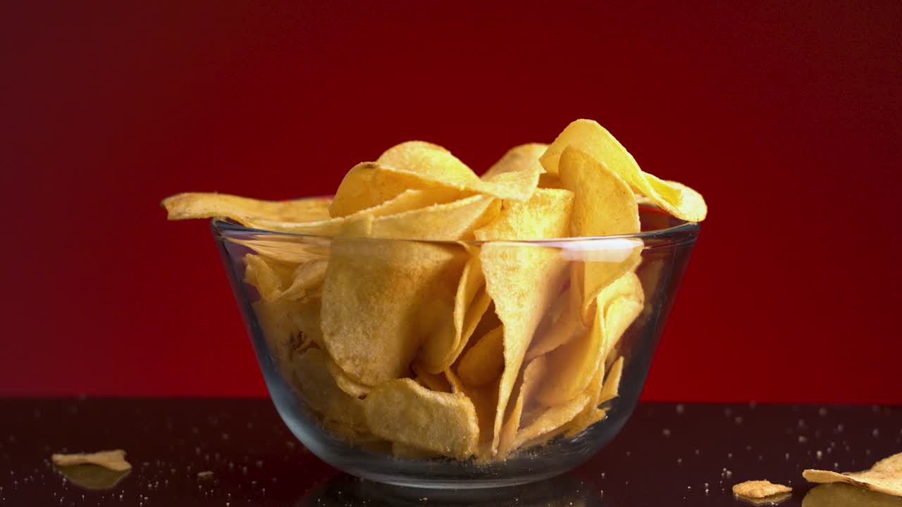 Crispy Potato Chips in a Glass Bowl