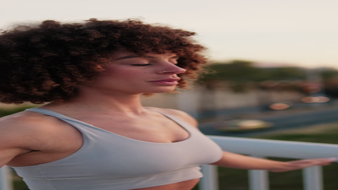Woman Doing Fitness Exercises on a Bridge