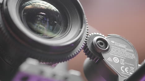 closeup of a professional camera lens and gears