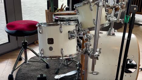 closeup drum kit white - 4 piece set. no people. only musical instrument.