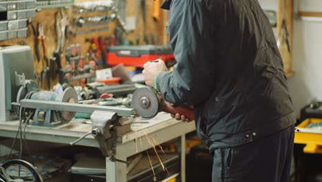 angle grinder cutting metal at workshop