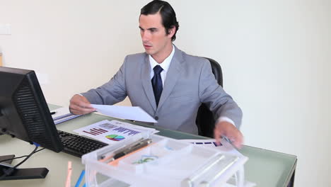 businessman working on graphs