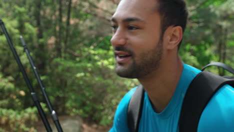 Portrait-of-Tired-Happy-Hiker-Man-Hiking-in-Mountain-Forest-Having-Rest-Stop-On-The-Trail,-Bearded-Trekker-Heavily-Breathing-Inhale-and-Exhale-Air---face-close-up