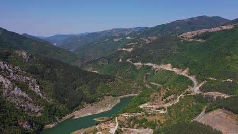 Flying-over-green-Rhodope-mountains-in-Bulgaria,-Europe-during-the-summer