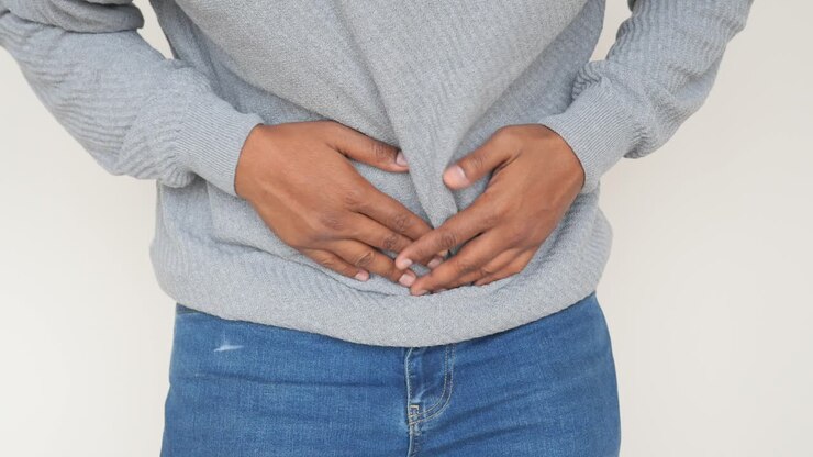 Man Holding Stomach in Pain
