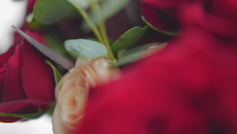 Colorful-roses-and-wet-eucalyptus-leaves-in-festive-bouquet