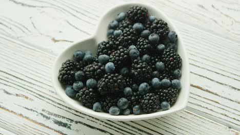 heart shaped bowl with berries