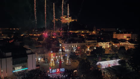 aerial-view-of-fireworks-in-a-portuguese-town-full-of-people