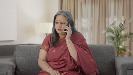 Indian-old-woman-talking-on-call