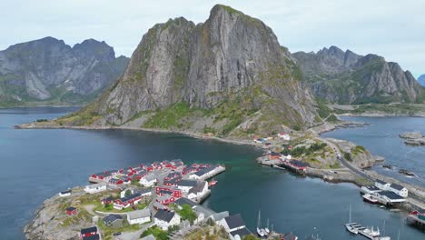 hamnoy village and red cabin houses in lofoten islands, norway - aerial 4k