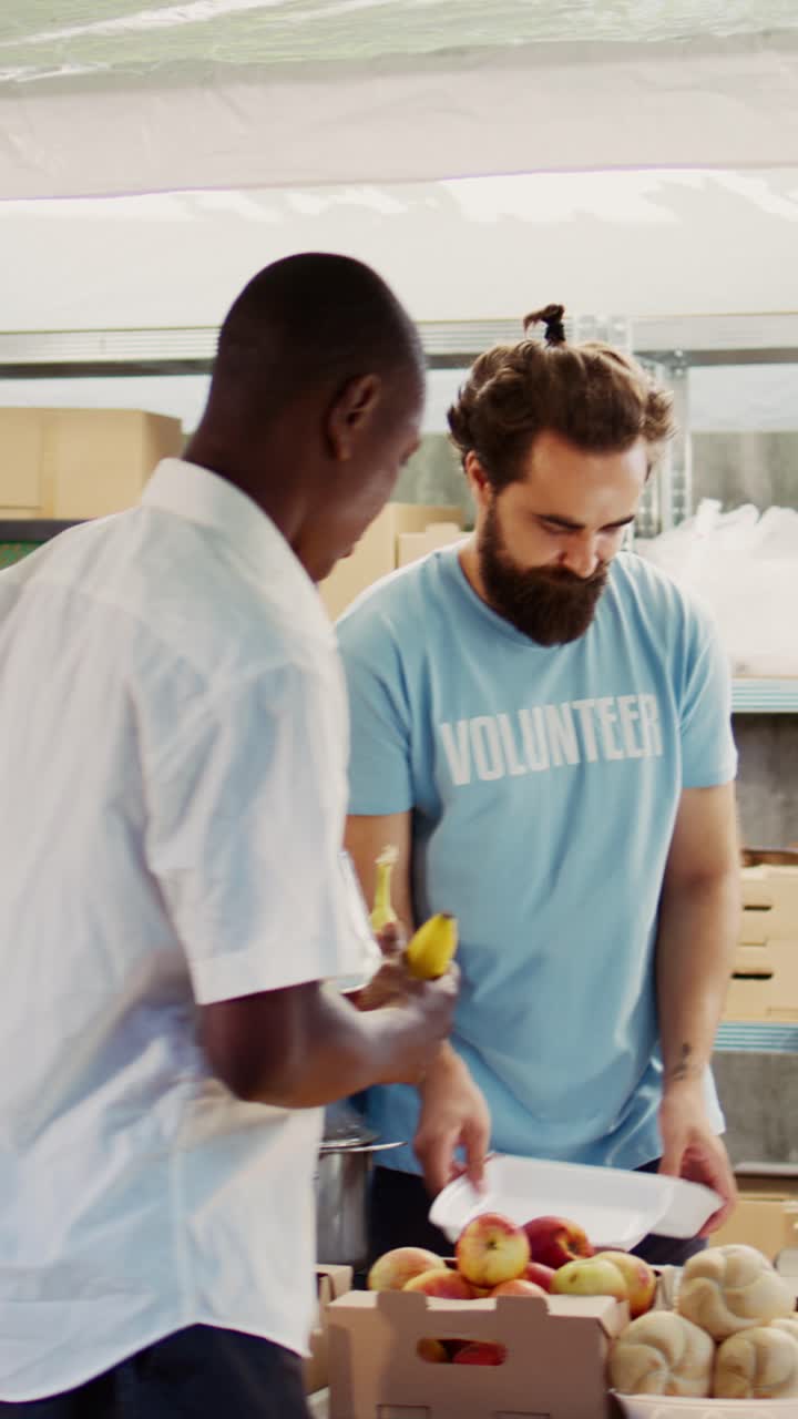 Vertical video Hunger relief team distributes free food