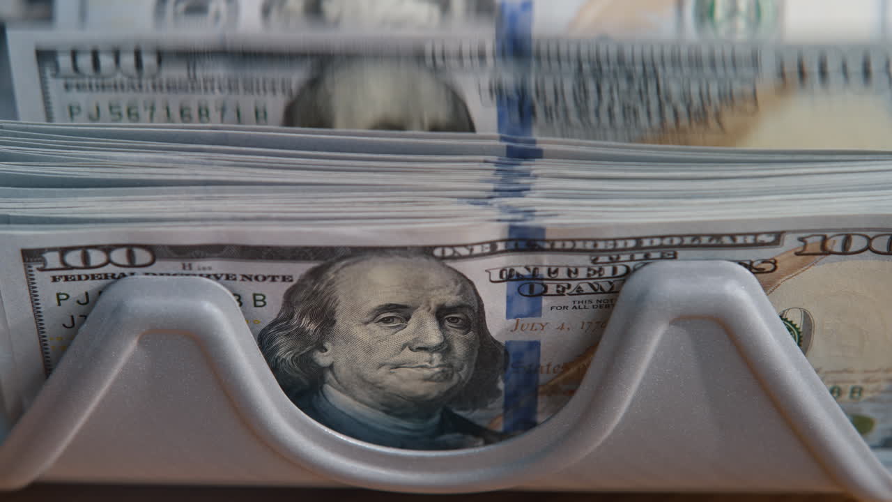 Closeup cash money calculating automatic equipment. Currency counting machine