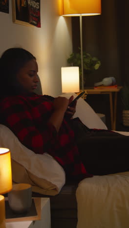 woman relaxing in bed at night