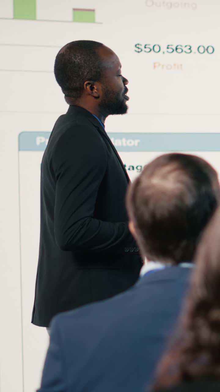 Vertical Video Black male and female hosting a presentation at the business conference event
