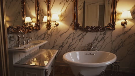 ornate marble bathroom with freestanding tub and double vanity