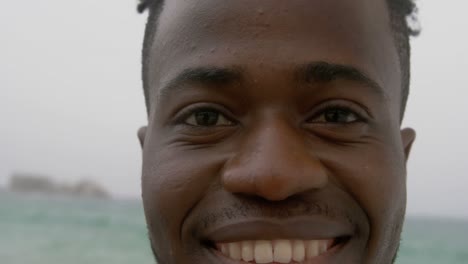 Close-up-of-African-American-man-standing-on-the-beach-4k