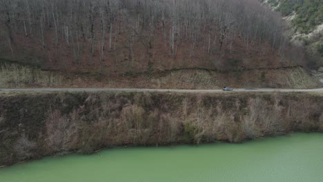 Car-On-Road-Near-Dam